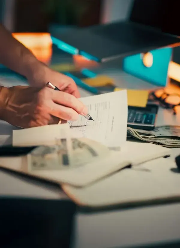 A person filling out a student loan autopay enrollment form on a laptop to qualify for the 1 percent interest rate discount.