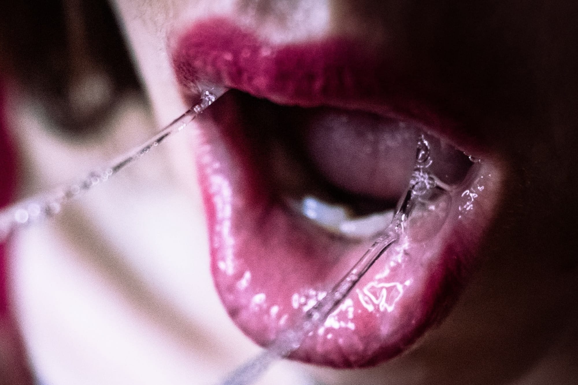 Water dripping down woman's lips