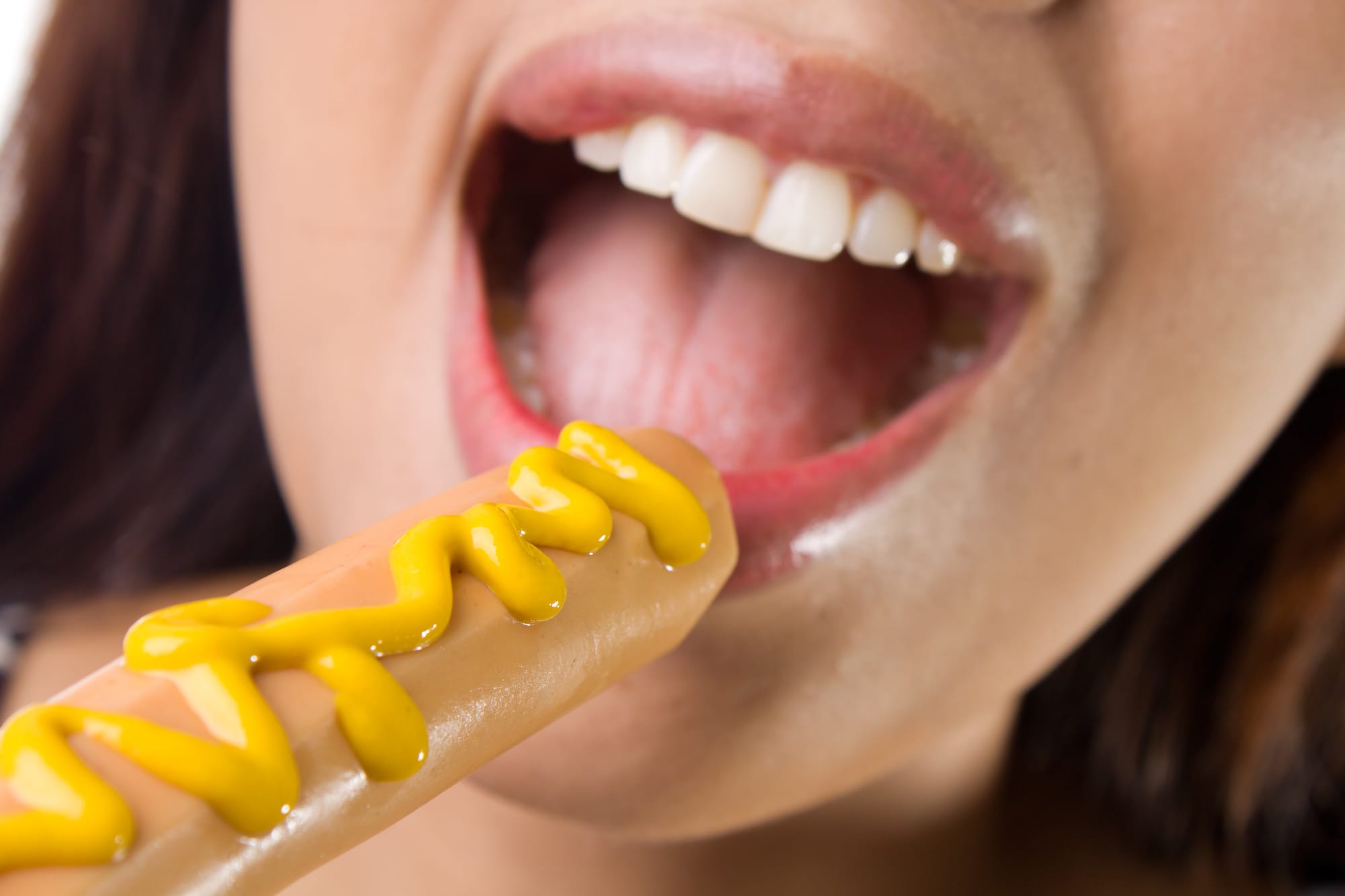 Hot woman sucking on hotdog