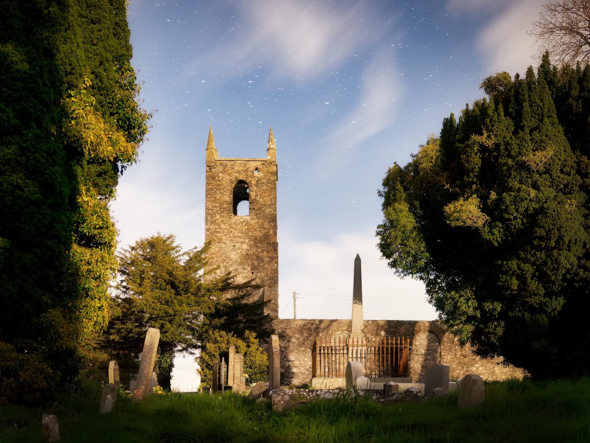 A derelict church lit by moonlight appearing as midday 