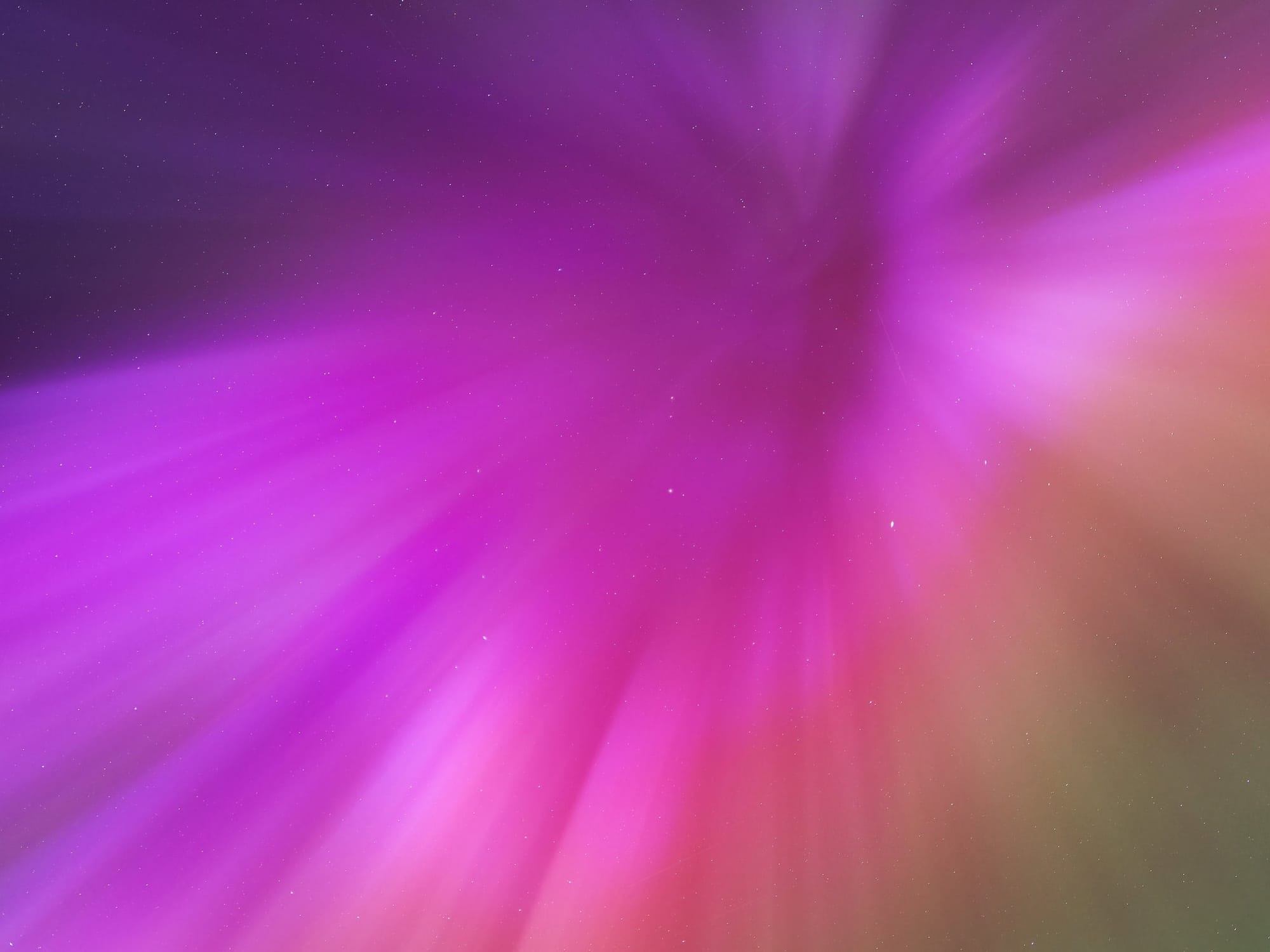 A tunnel of pinks, reds and violets. Looks like a time vortex in the sky.