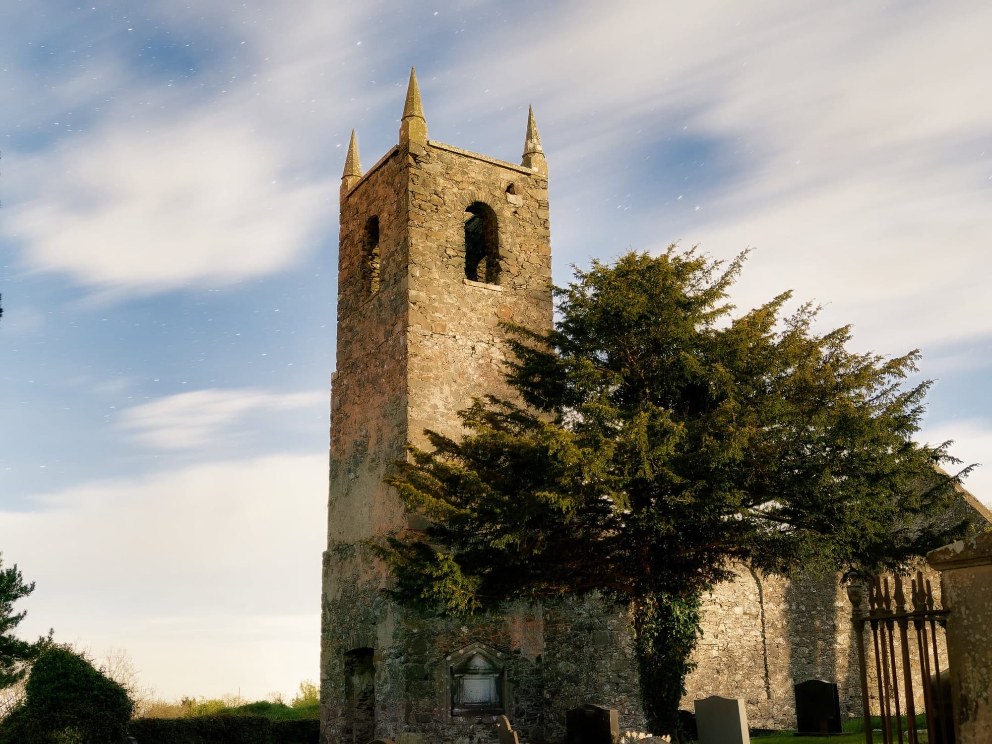 An old church ruin lit only by the full moon