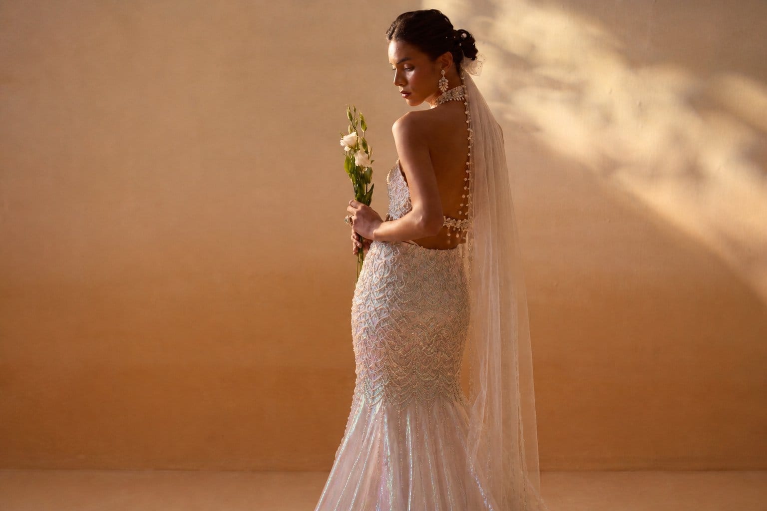Sheer iridescent fishtail skirt with pearl and shell jewelry