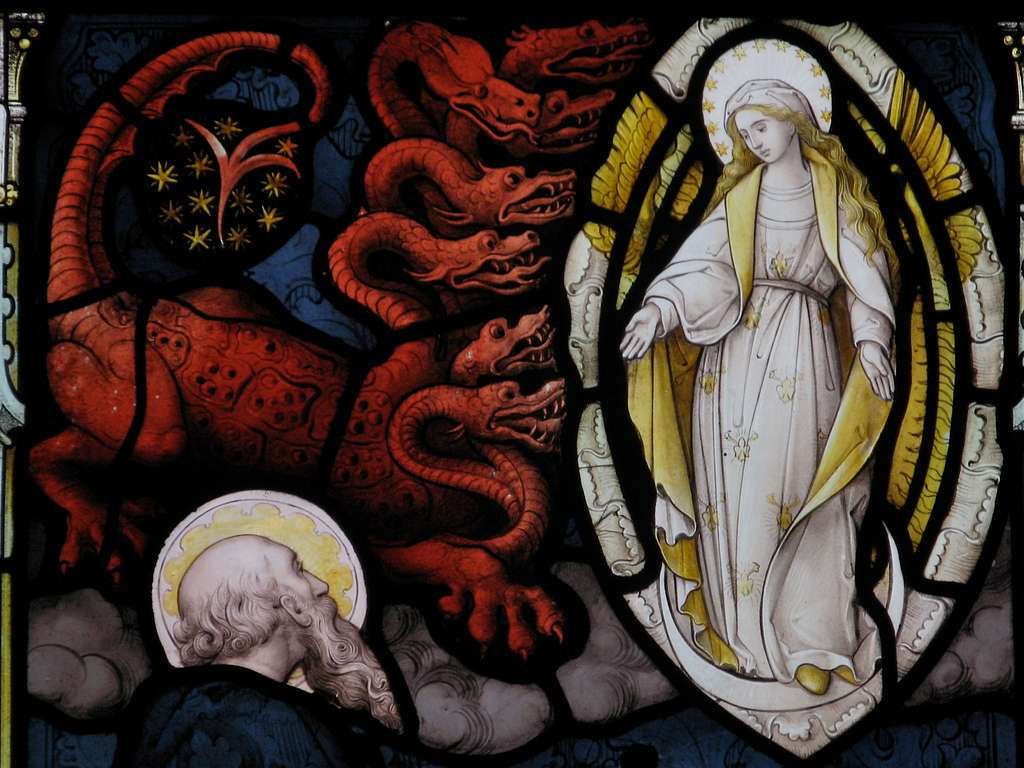 An image of the woman and the dragon of Revelation 12 as depicted in stained glass in the parish church.