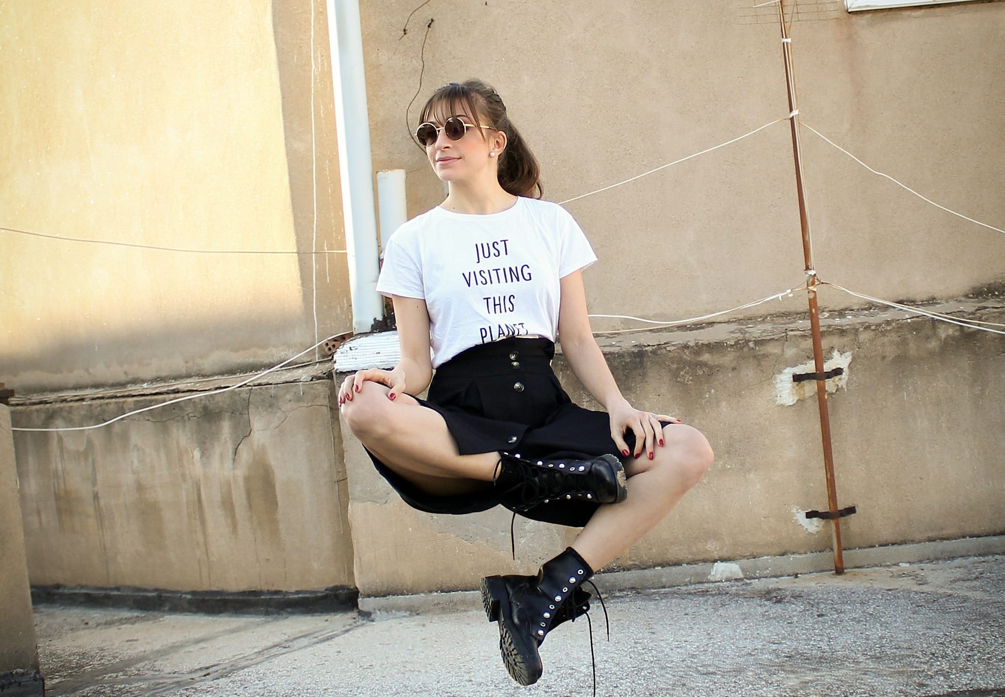 woman floating on the air near beige wall