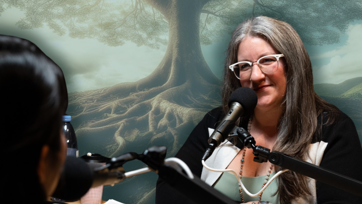 Michelle Hecker Davis at the Nooga Podcast Network Studio interviewing a female guest with a big rooted treat in the background