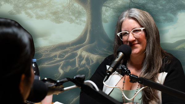 Michelle Hecker Davis at the Nooga Podcast Network Studio interviewing a female guest with a big rooted treat in the background