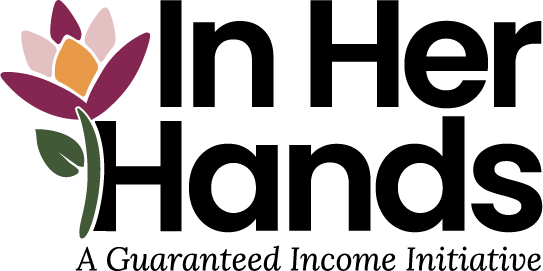 In Her Hands program logo, with purple flower and the words 'A Guaranteed Income Initiative'