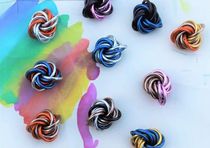 a variety of multicolored aluminum ring Mobiis