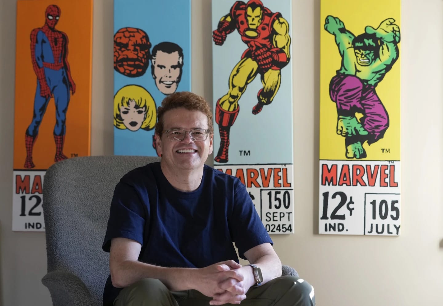 Jeff Atwood inside home sitting in a grey chair, with four panels of art reproducing 1960s comic book corner box art: Spider-Man, The Fantastic Four, Iron Man, and Hulk