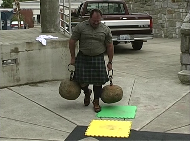 Steve Jeck carries a pair of ringed stones before saying 'Grab hold of your dream and don't let go'.