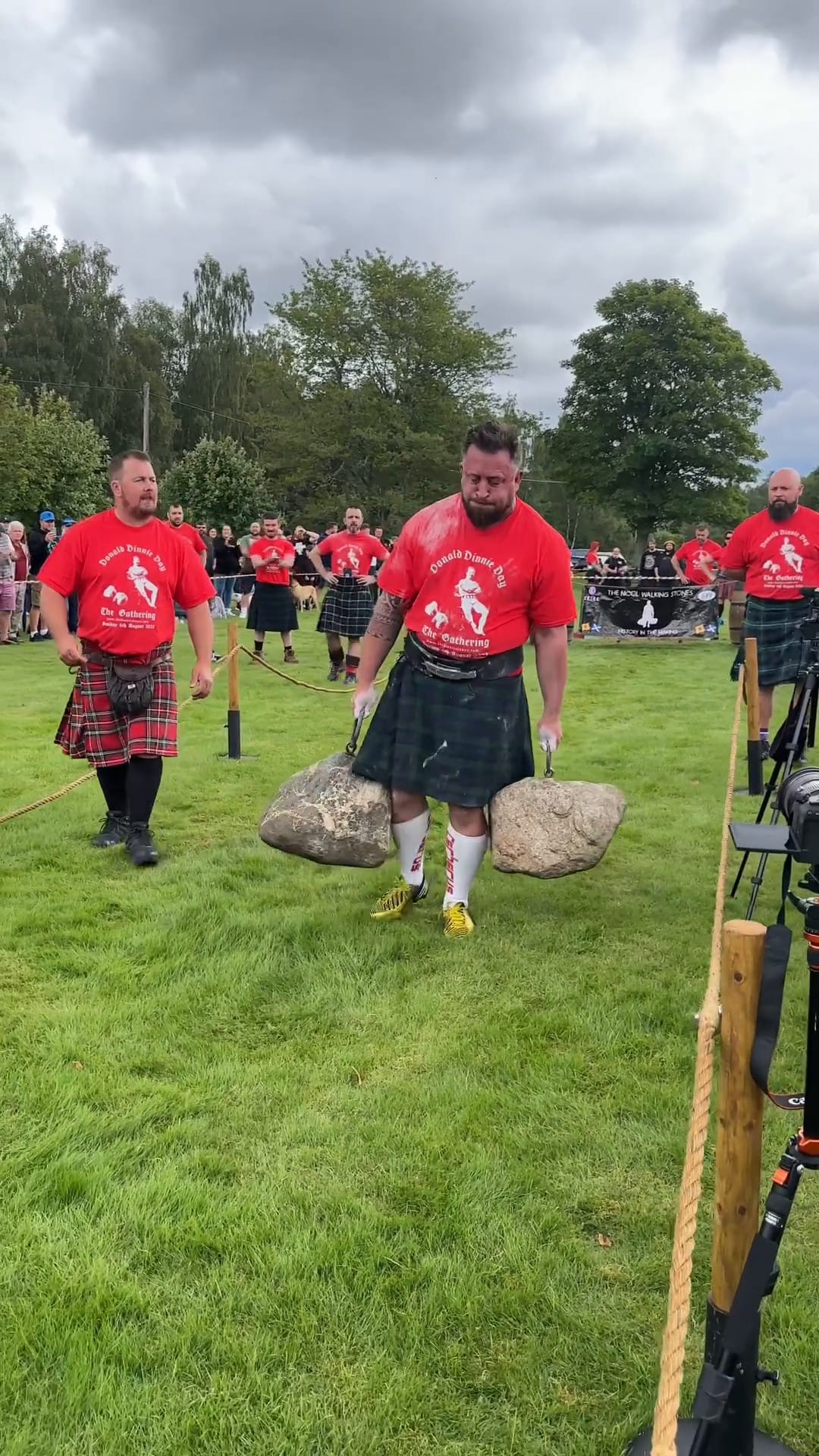 Chris Beetham walks on a grass course with the Nicol Walking Stones.