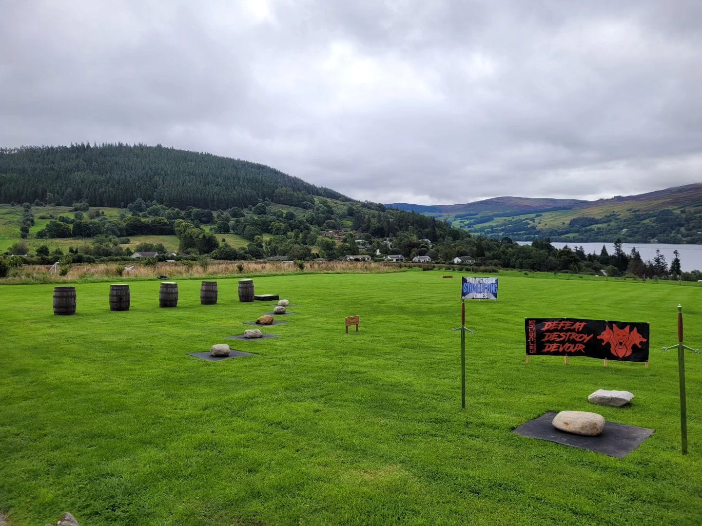 A picturesque photo of Scotland with a stonelifting competition laid out.