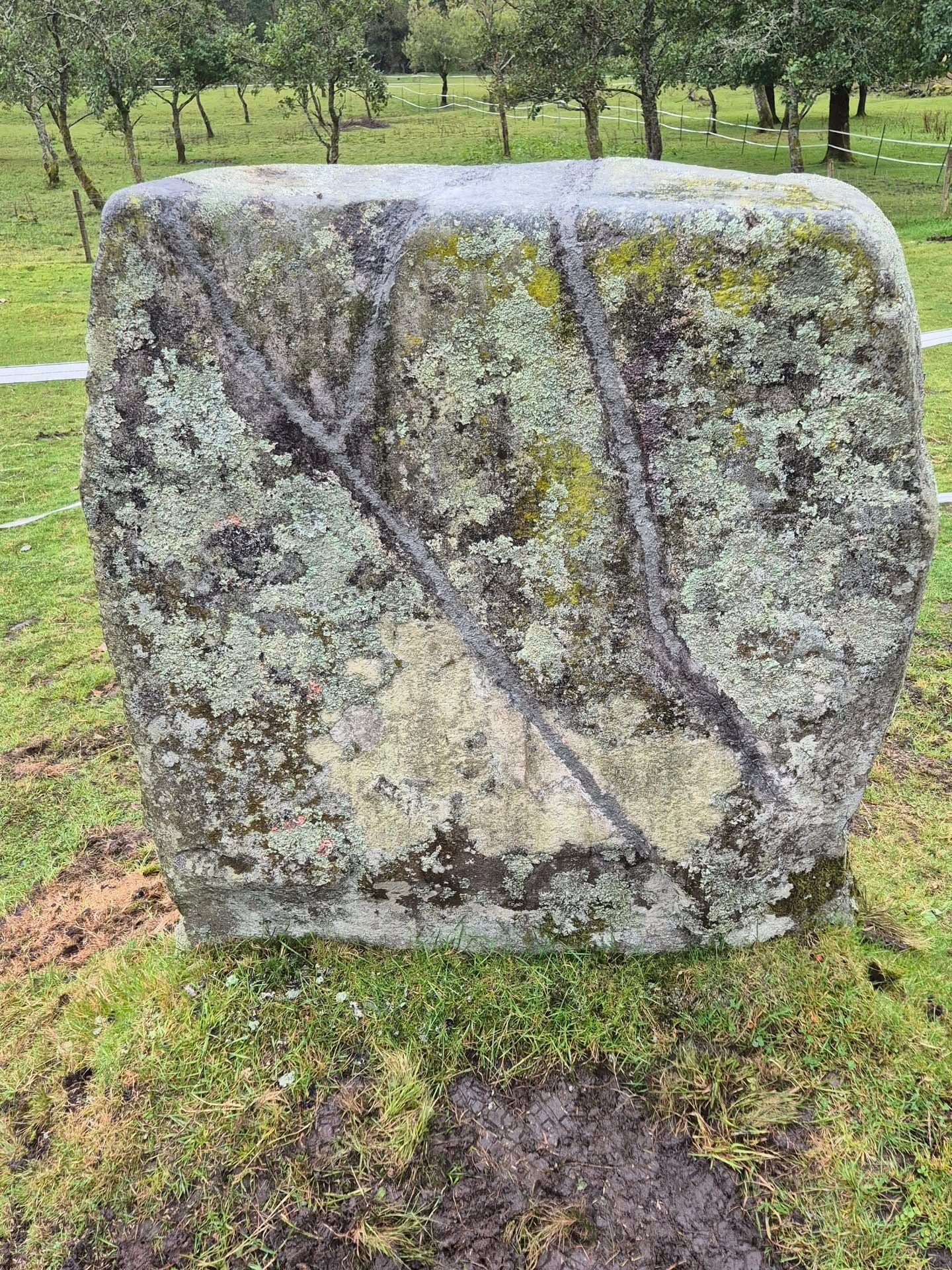 A large standing rectangular plinth with visible repair lines.