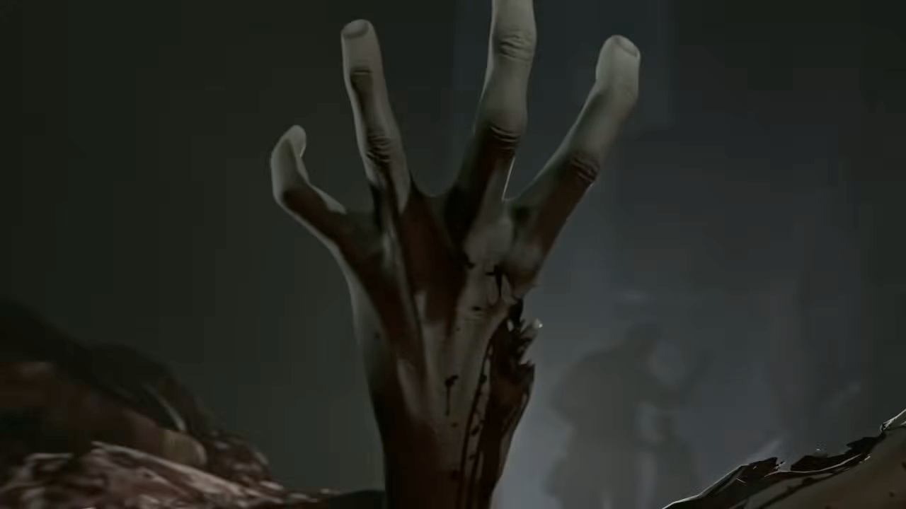 A screenshot from the opening intro of Left 4 Dead, focused on a zombie's left hand with a ripped out thumb.