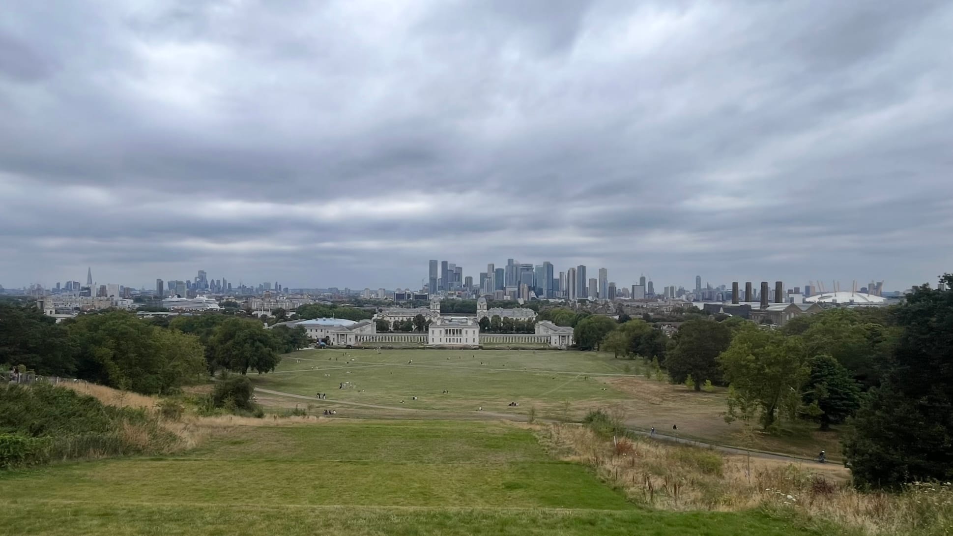 The view of London from the Greenwich Observatory. The Maritime museum is visible, along with the Shard, the City of London, and the O2 Arena.