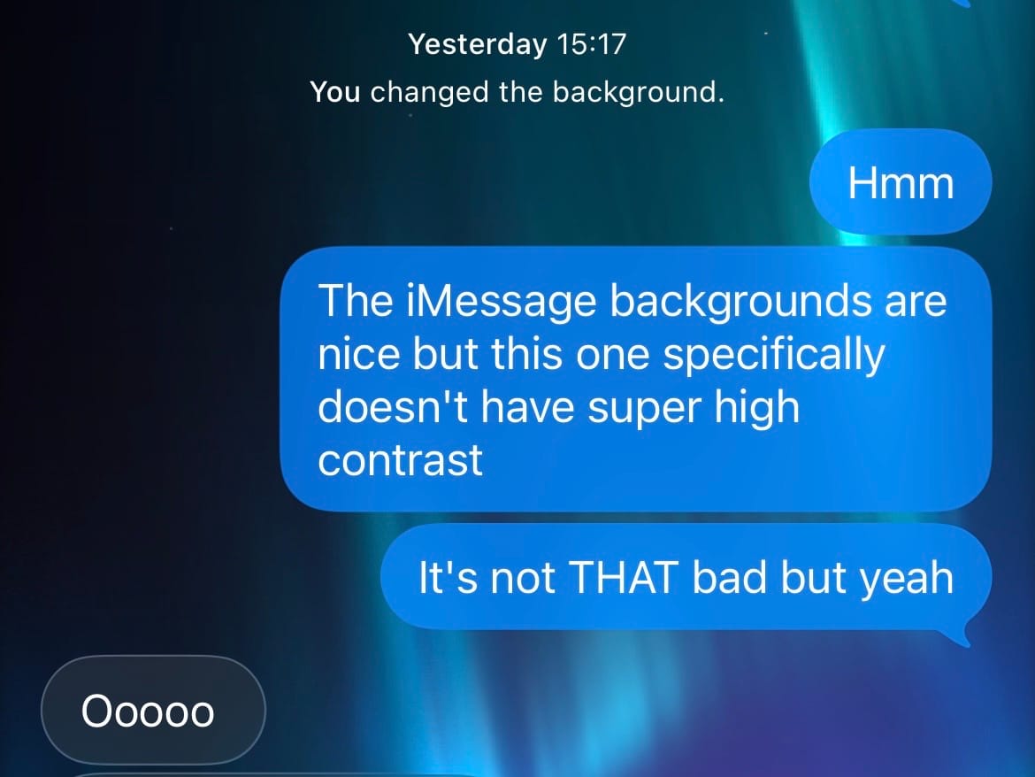 Some message bubbles in iMessage against the new Green Aurora background.