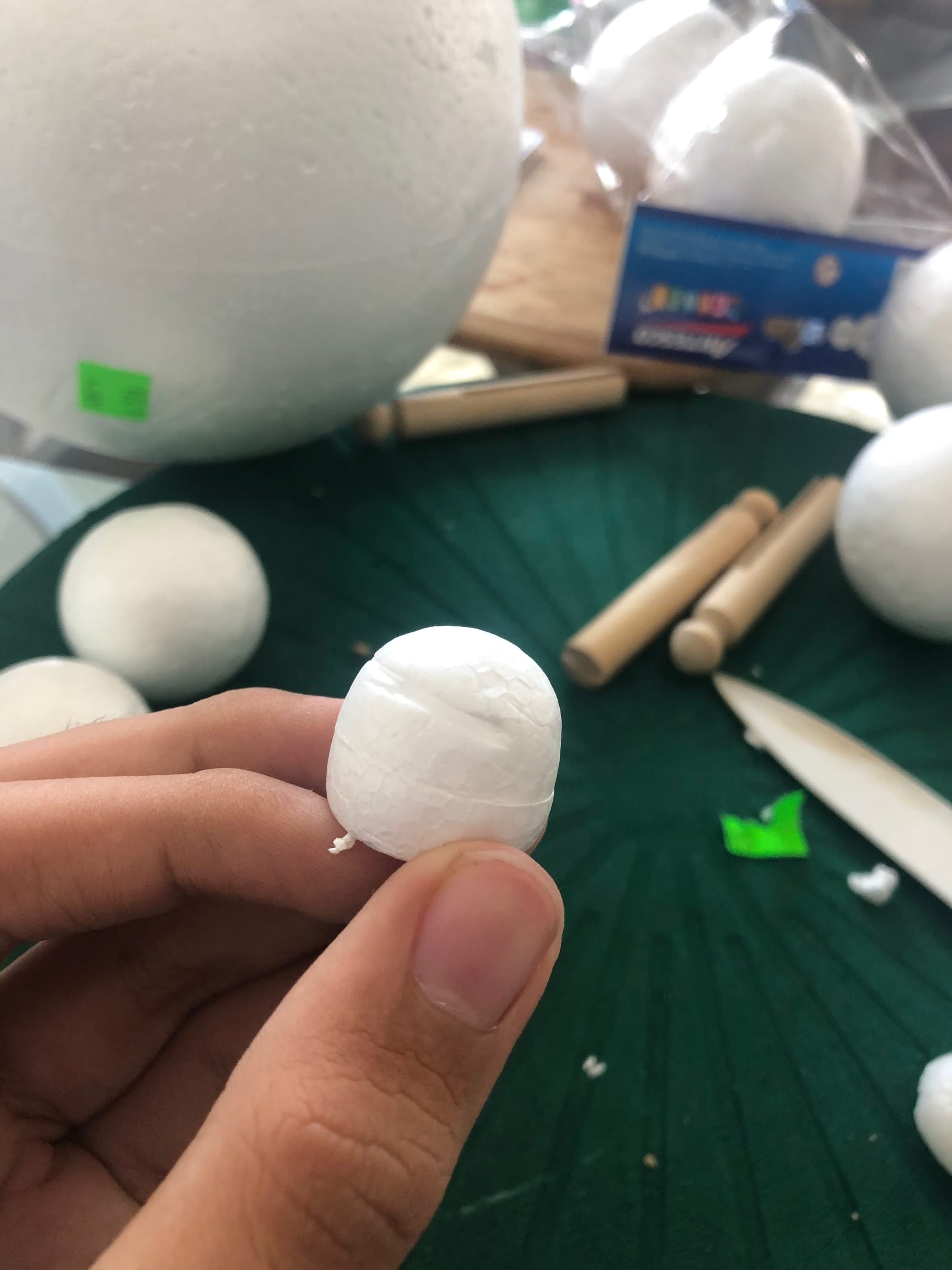 Me holding a lobsided styrofoam sphere.