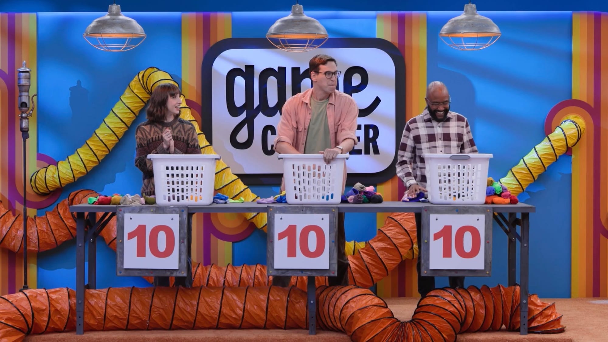 A screenshot of Game Changer S8Ep3: Night Shift, featuring the night shift: Katie Marovitch, Grant O'Brien, and Raphael Chestang.