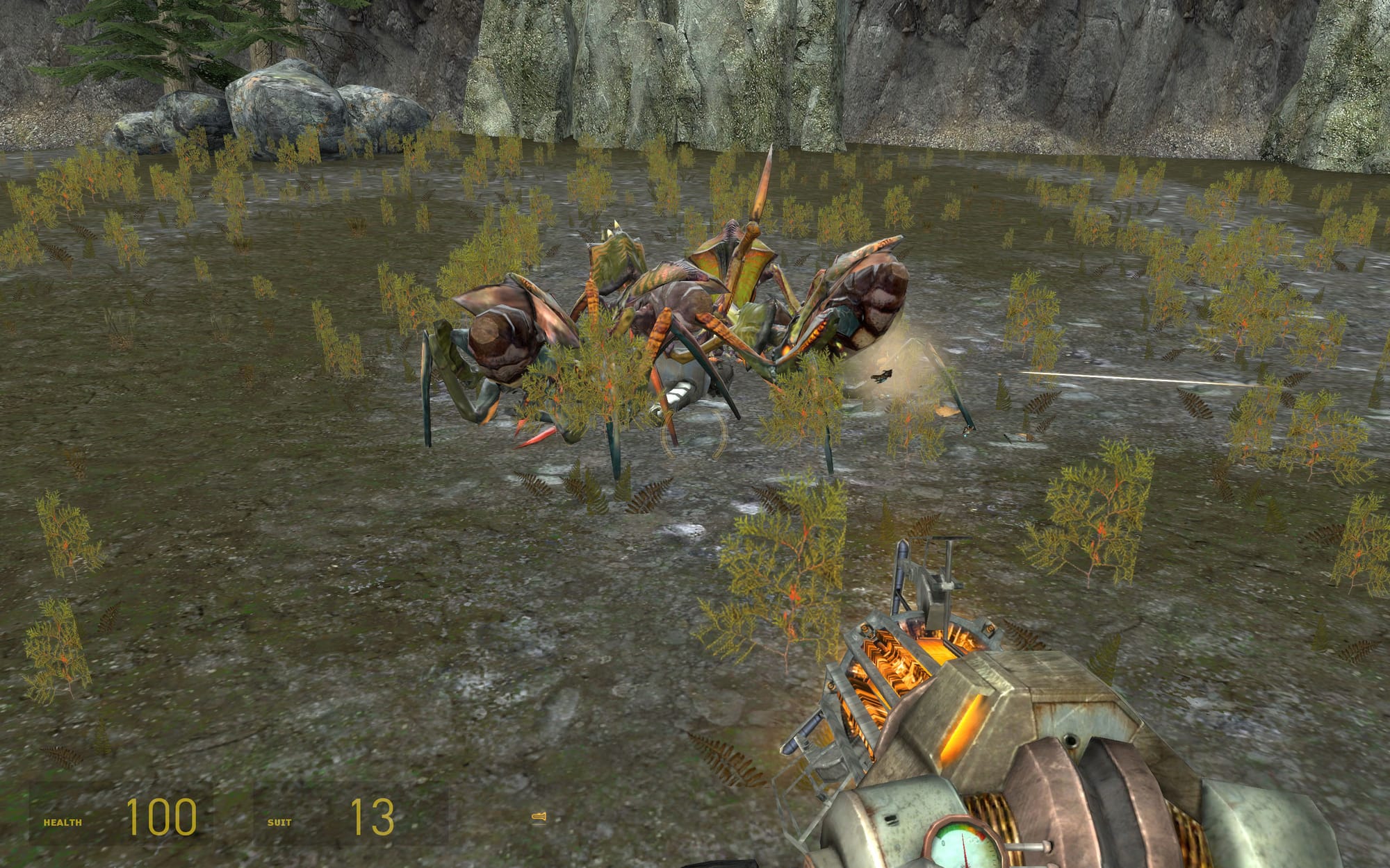 A screenshot of the HL2: Episode Two beta map Outland 05a. it features a group of four antlions feeding off the corpse of a Combine soldier.