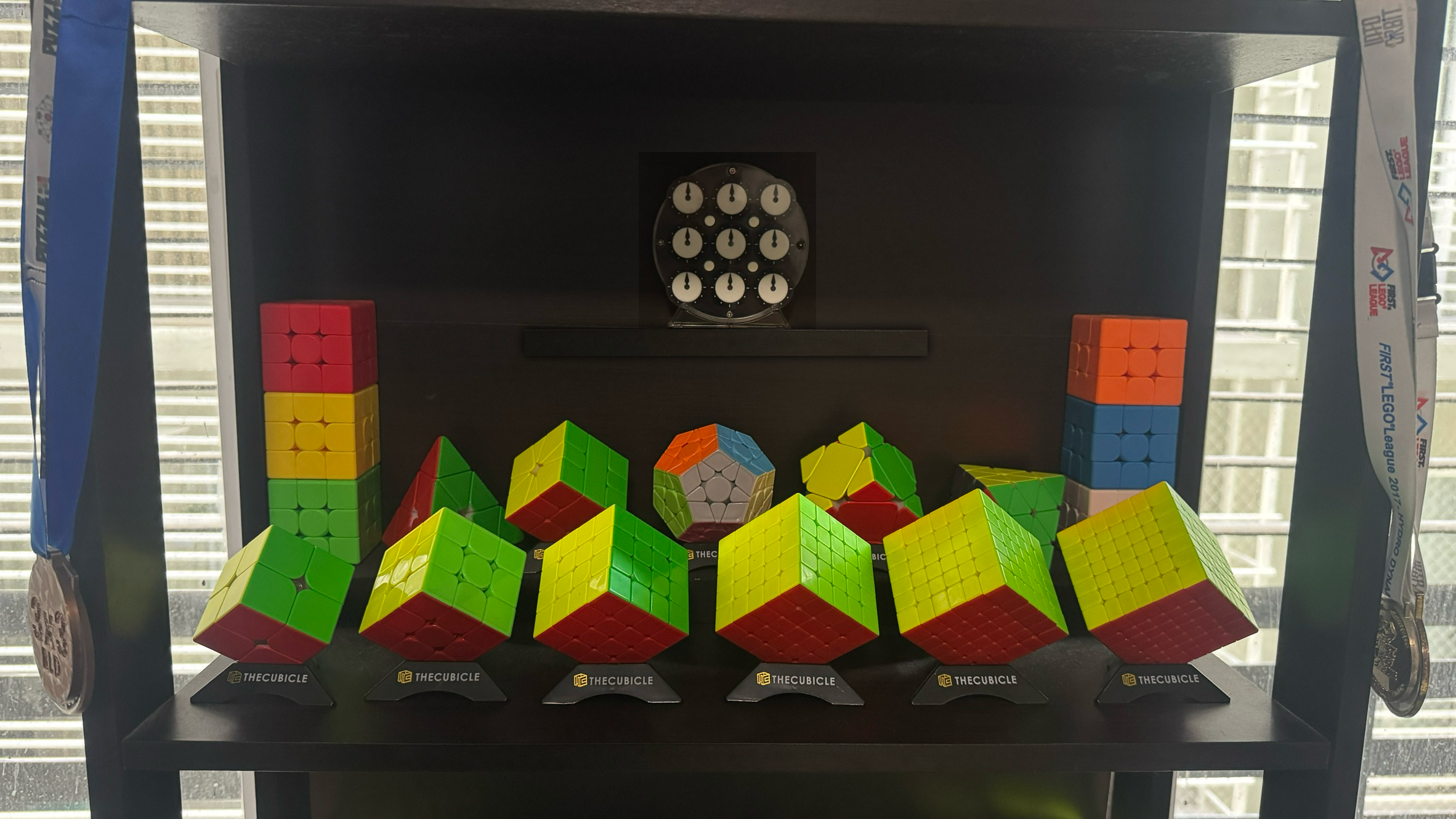 A mockup of a plan I had for my cubeshelf. It adds the Face-Turning Octahedron, and adds a shelf for the Clock to go in above the other cubes.