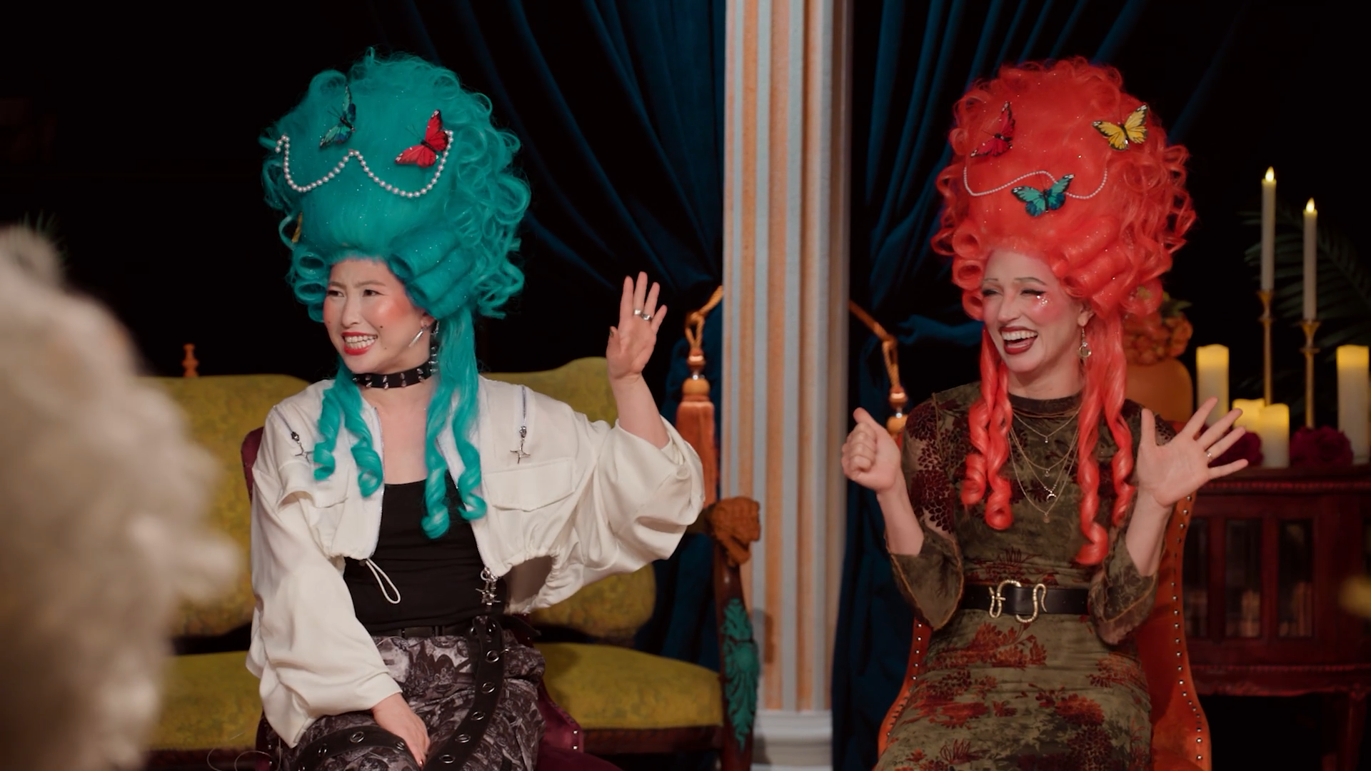 A screenshot from Game Changer S8Ep07, "Earwigs". Erika Ishii and Becca Scott are in frame, mocking Sam from a distance.
