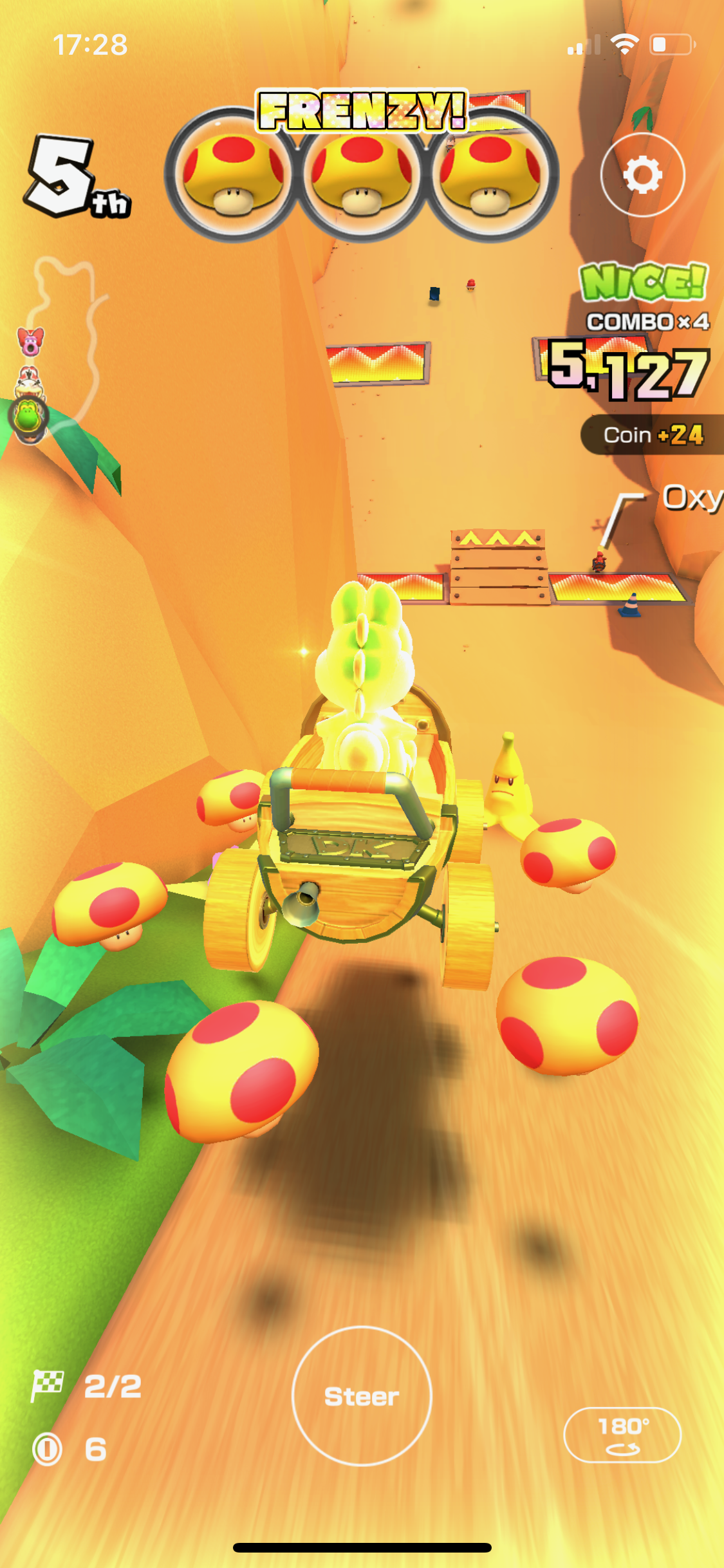 Yoshi with a Mega Mushroom frenzy in 3DS Rock Rock Mountain in Mario Kart Tour.