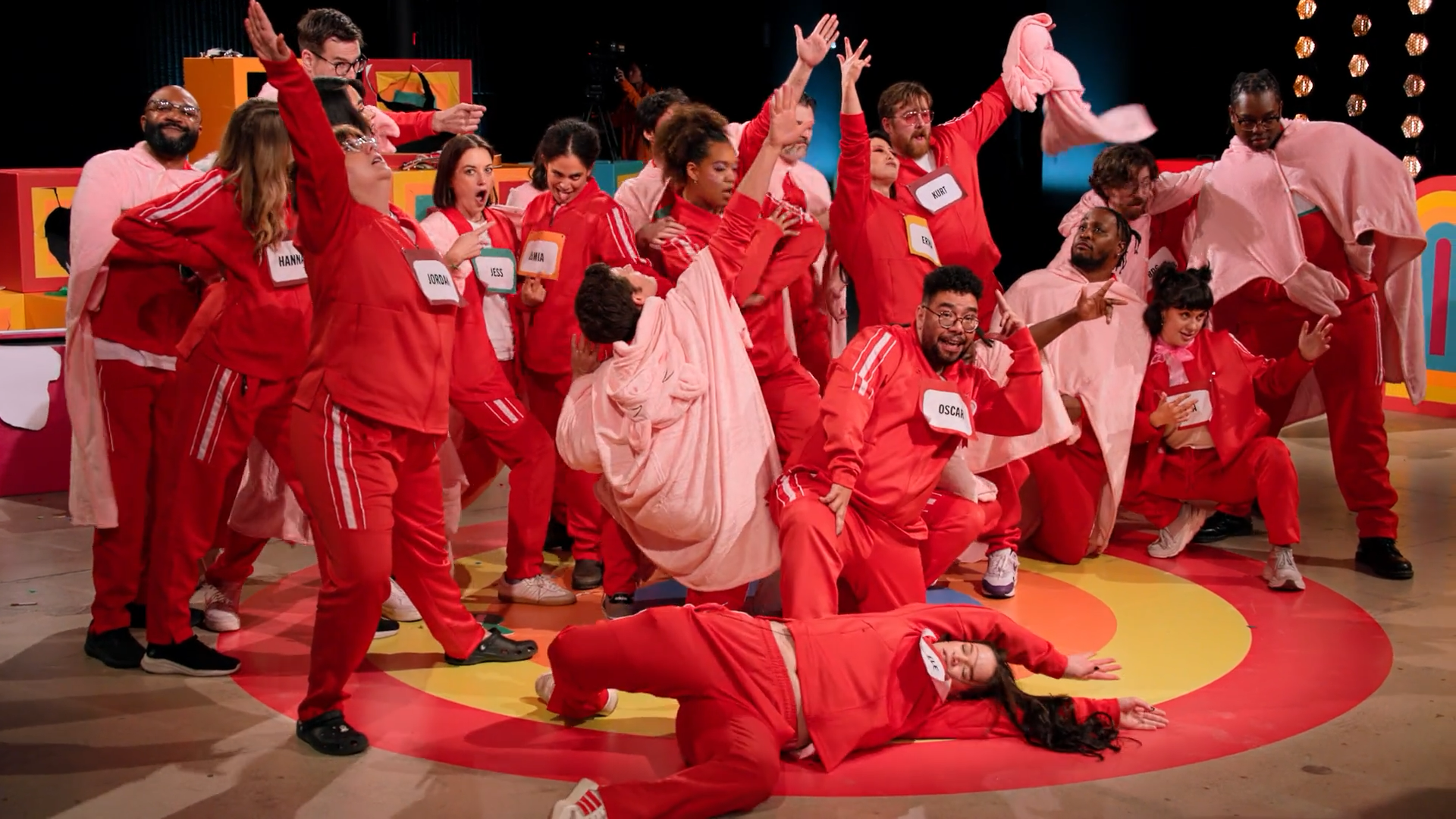 A screenshot of Game Changer S8Ep10, "Last Talent Standing". The 23 contestants are all in a variety of cool poses after just having finished a dance.