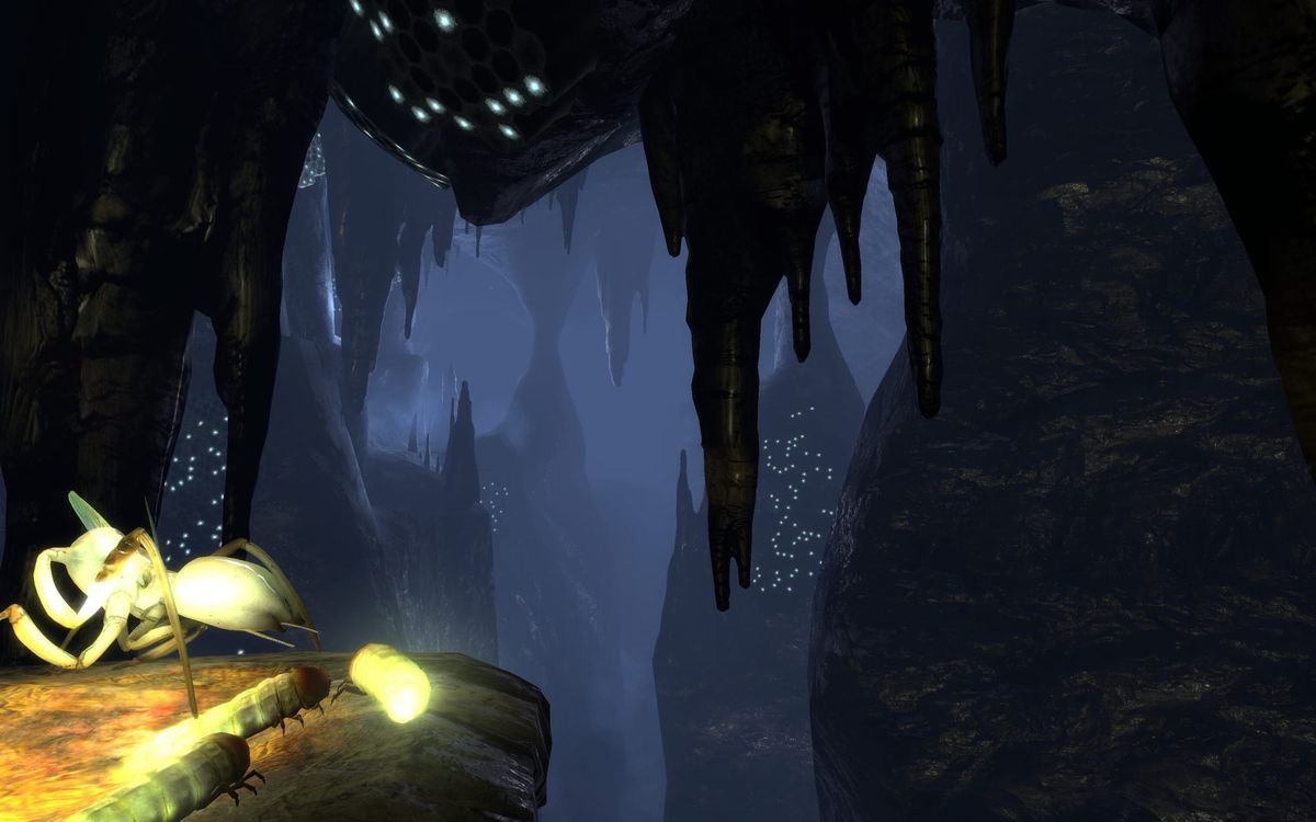 A screenshot of the main menu background of the mines (ep2_background02), featuring three grubs and an Antlion Worker at the edge of a cliff in the caves.