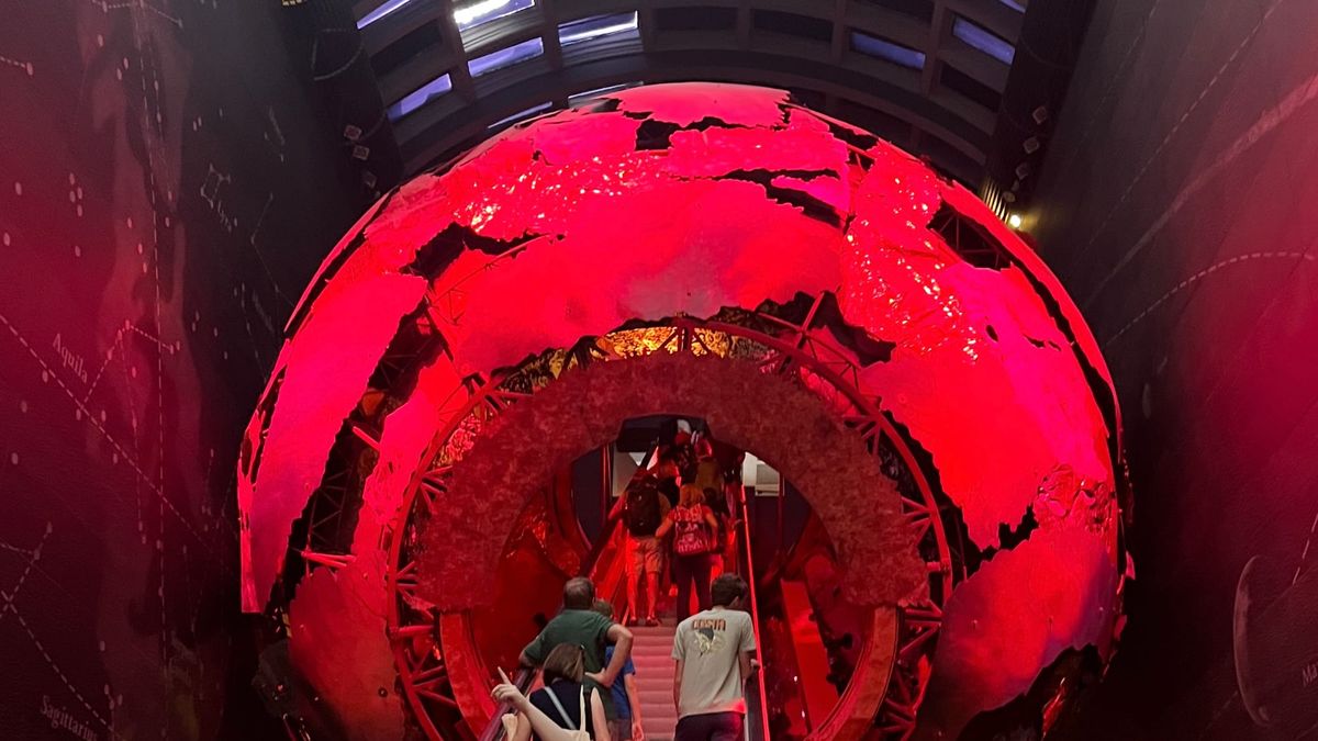 The escalator in the London Museum of National History. A slow-moving escalator which goes through a representation of the Earth's core.