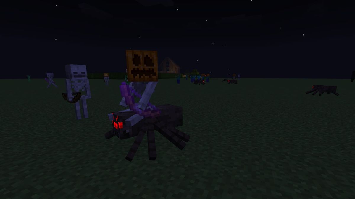 A screenshot from Minecraft, highlighting a Spider Jockey wearing a pumpkin on its head. Other zombies and skeletons are in the background also wearing pumpkins, including one with a Jack O'