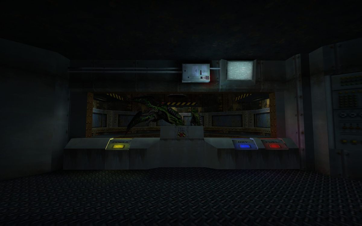 A screenshot from the Blast Pit chapter of Half-Life. The view is from the main control room looking into the Tentacle-infested silo.