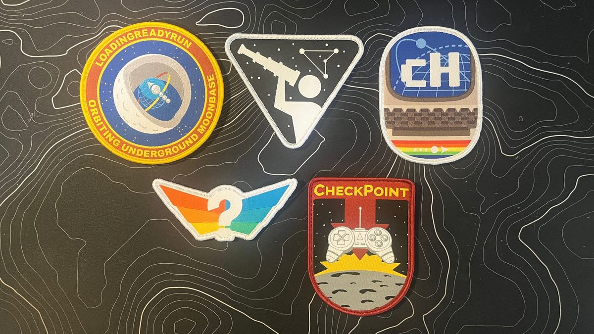 LoadingReadyRun's Moonbase Mission Patches. A group of five patches representing LRR and some specific shows (the Crapshots, commodoreHUSTLE, the Panalysts, and CheckPoint.
