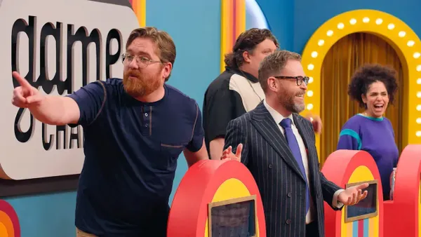 The thumbnail for Game Changer S8Ep8, "What's The Catch". It features Kurt Maloney, Jacob Wysocki, and Kimia Behpoornia behind their podiums with Sam next to them. Kurt is pointing accusingly