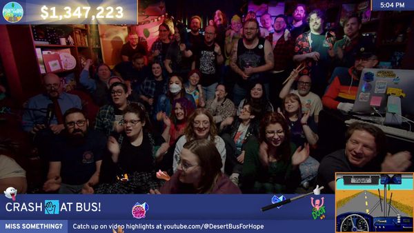 A screenshot of the end of Desert Bus For Hope 2026. The dance lights are on, almost everyone is around, they've all just sung The Final Busdown, and are all cheering to crash the bus.