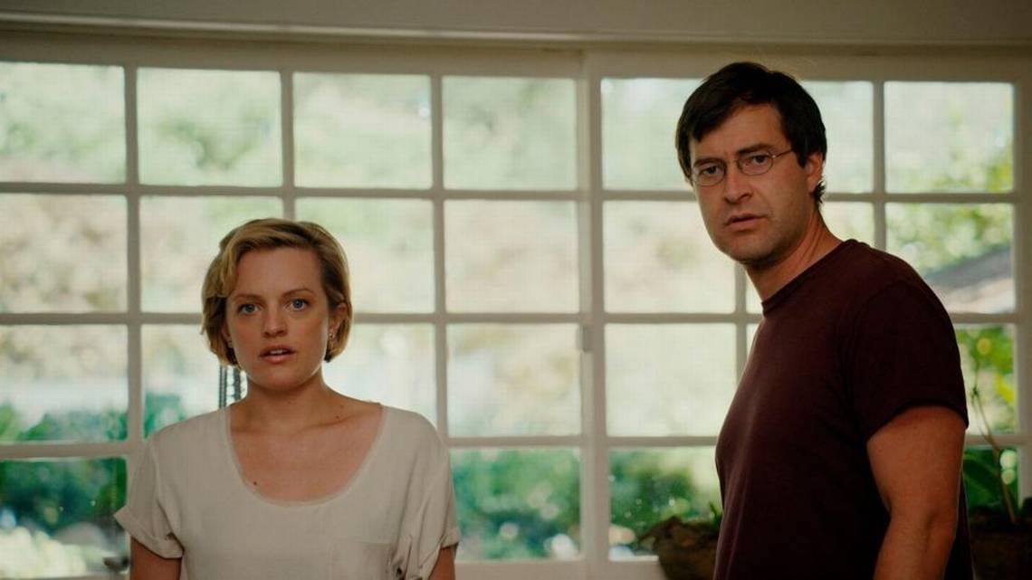 Sophie (Elisabeth Moss) and Ethan (Mark Duplass) look at something in The One I Love