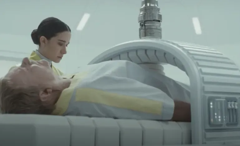 A young woman works to remove a live peserving machine from a comatose older man.