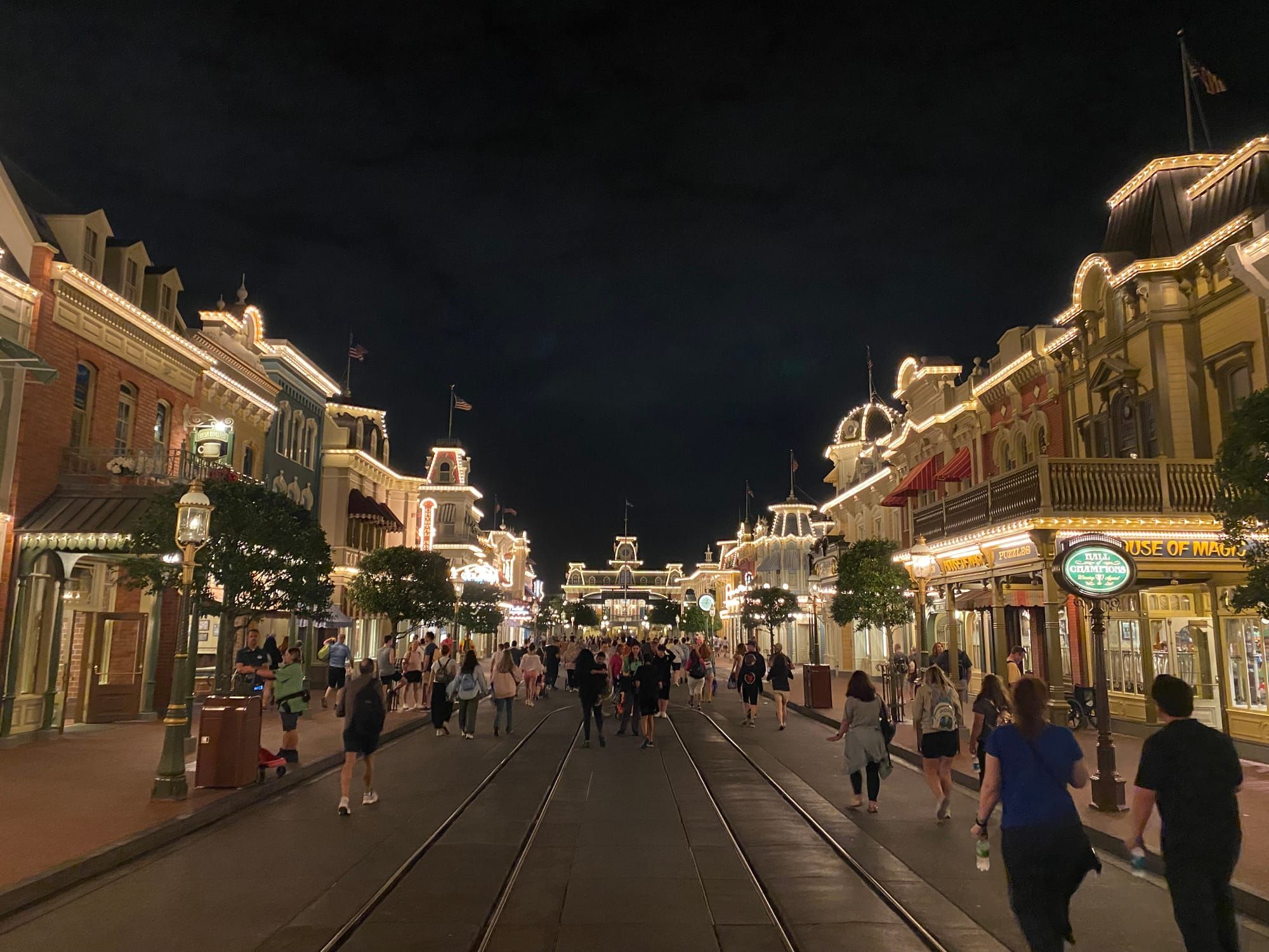 Main Street USA at Magic Kingdom in Disney World. Its nighttime and the camera is pointed towards the train station.