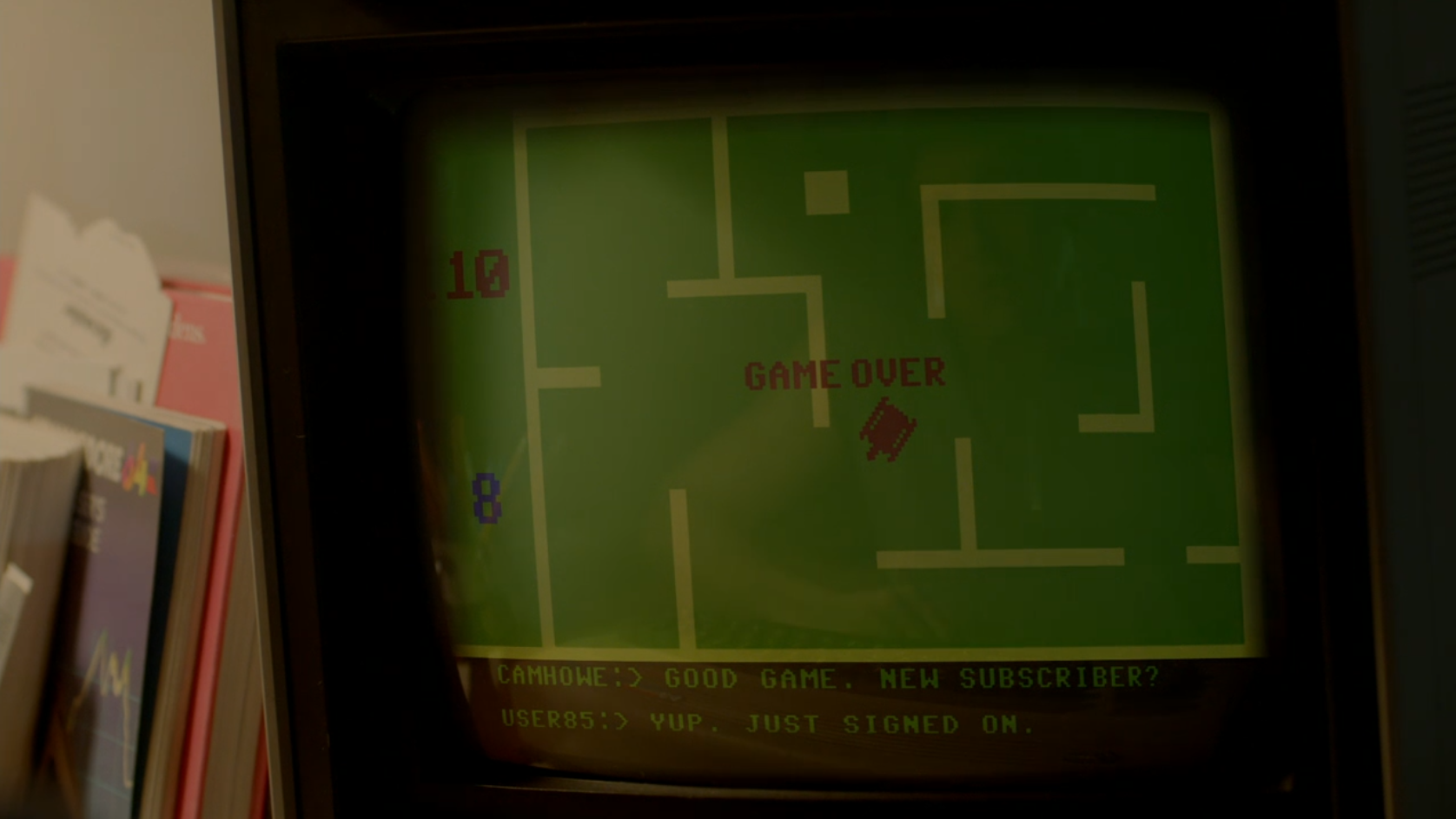 A vintage computer monitor showing a game over screen in a tank battle game.