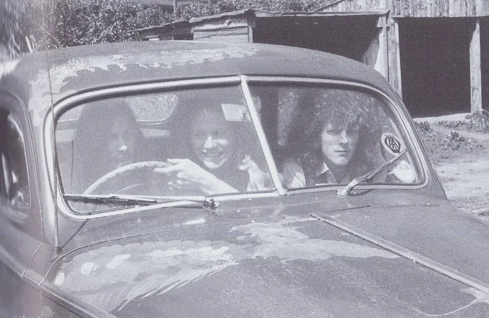 Members of Dr. Strangely Strange sitting in a car.
