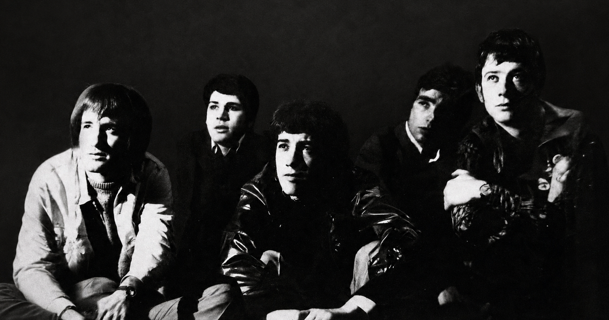 The five members of The Fox posed in a dramatic black-and-white 1968 band portrait