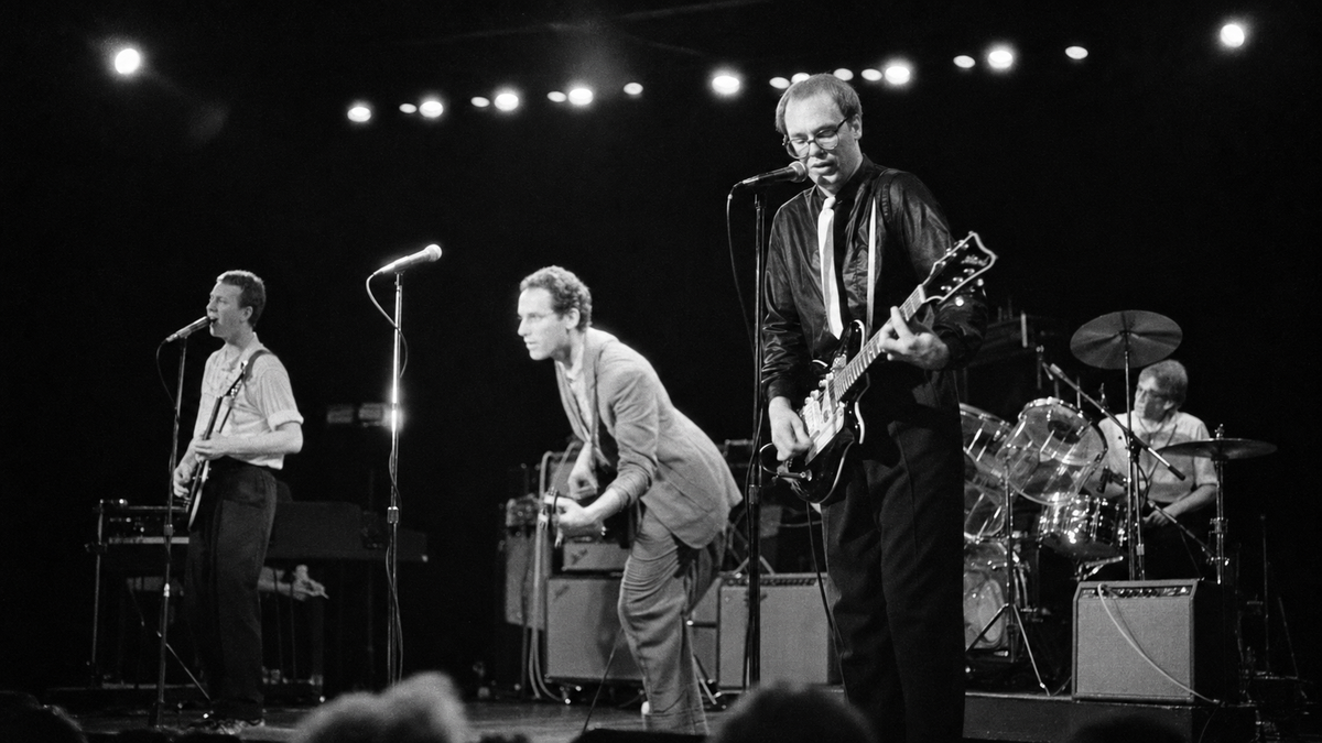 Bates Motel’s four musicians performing onstage in a black-and-white archival photograph, digitally reframed for this feature.
