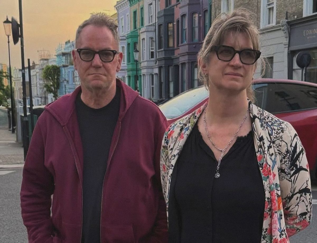 Philip Shelley and Amanda Thorpe wearing sunglasses on a street in Ladbroke Grove, London.