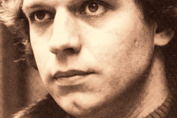 Colorized 1970 head-and-shoulders portrait of Duffy Power, looking left down a London alley, wearing a turtleneck and fur-collared coat.