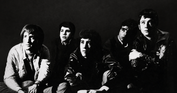 The five members of The Fox posed in a dramatic black-and-white 1968 band portrait