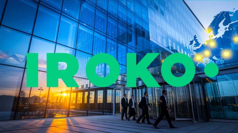 Le siège d'Iroko, un bâtiment moderne avec des hommes d'affaires qui entrent.