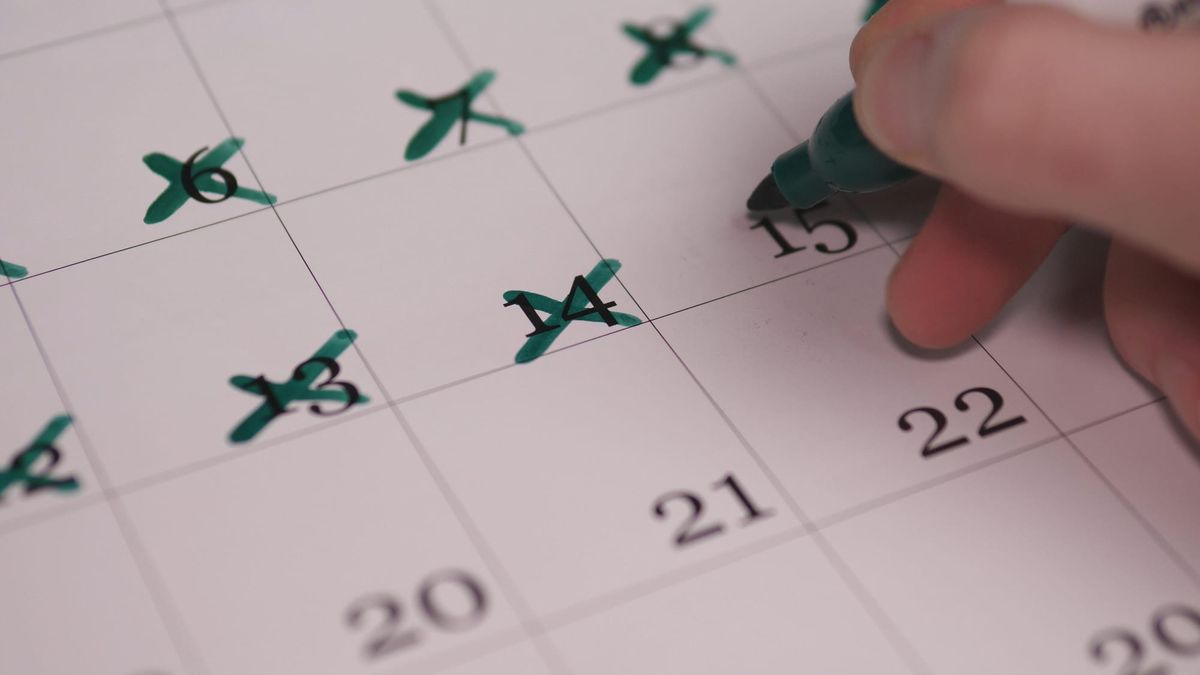 Close-up of a calendar with days crossed off, representing the passage of time and loss of momentum in a job search