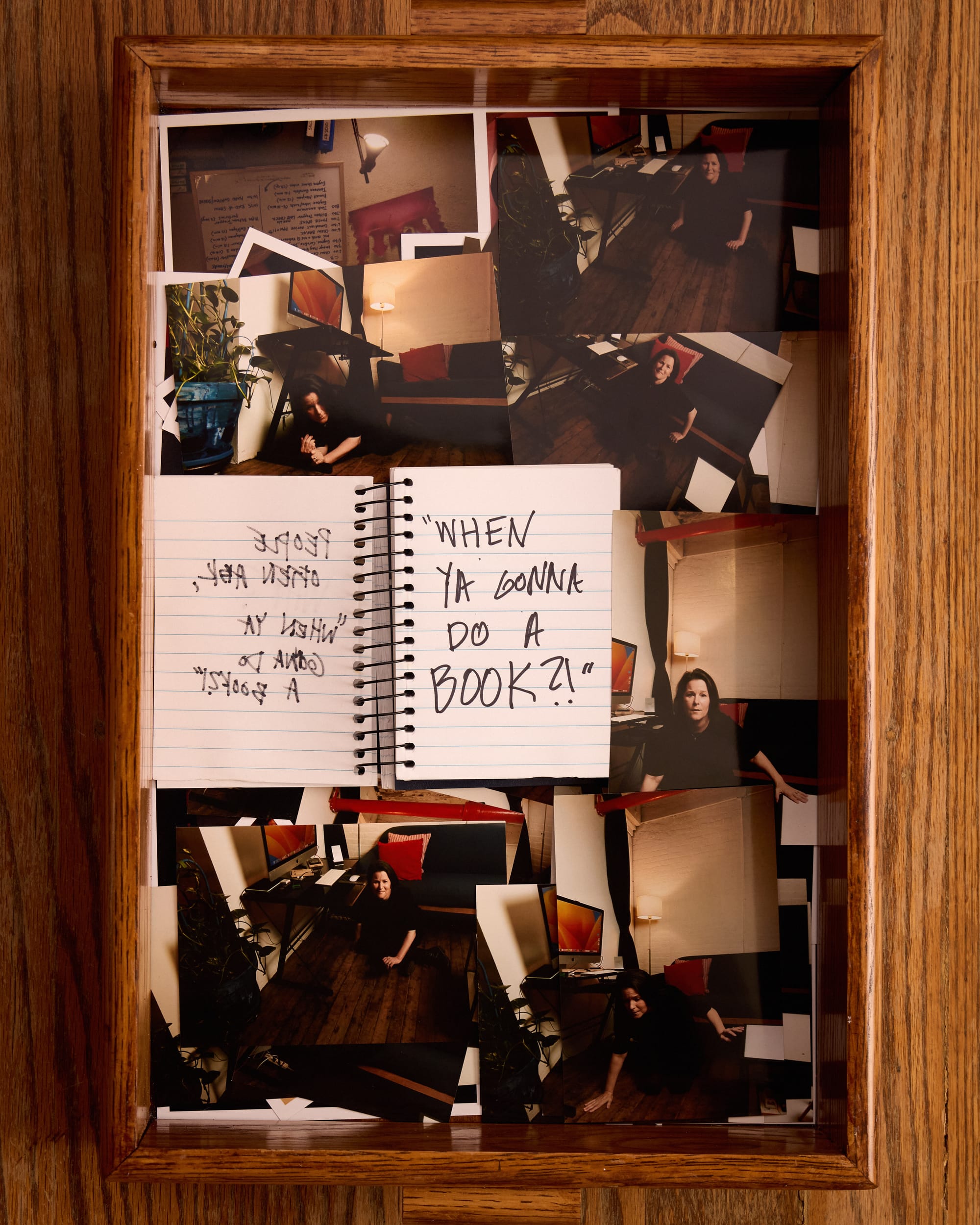 The notebook now says "When you gonna do a book?!". In the tray of 4x6 photos, Mindy looks stressed while falling off the couch in her studio. 