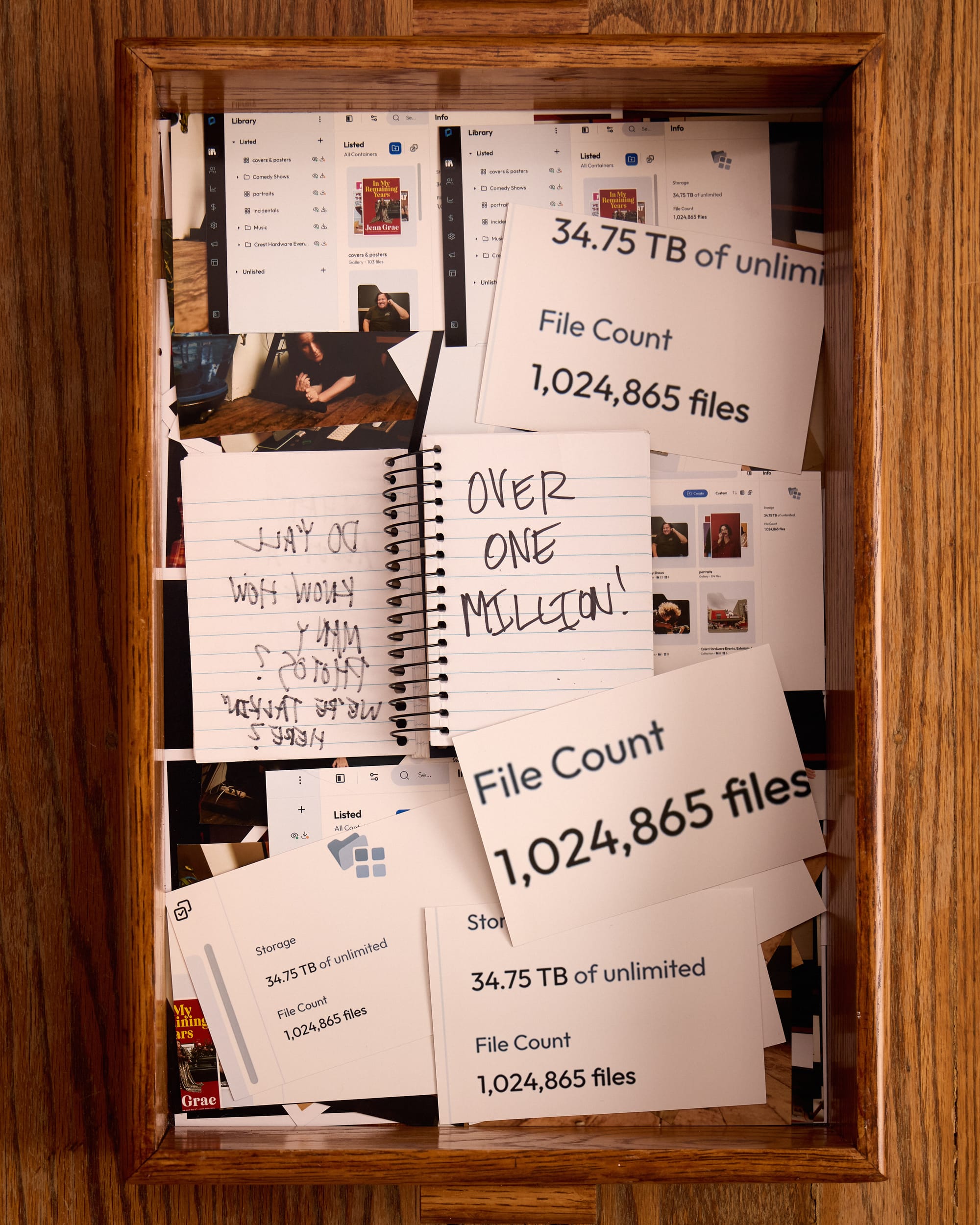 The notebook now says “OVER ONE MILLION” In the tray of 4x6 photos, there are screen grabs of Mindy’s archiving website, showing there are over 1 million photos stored there. 