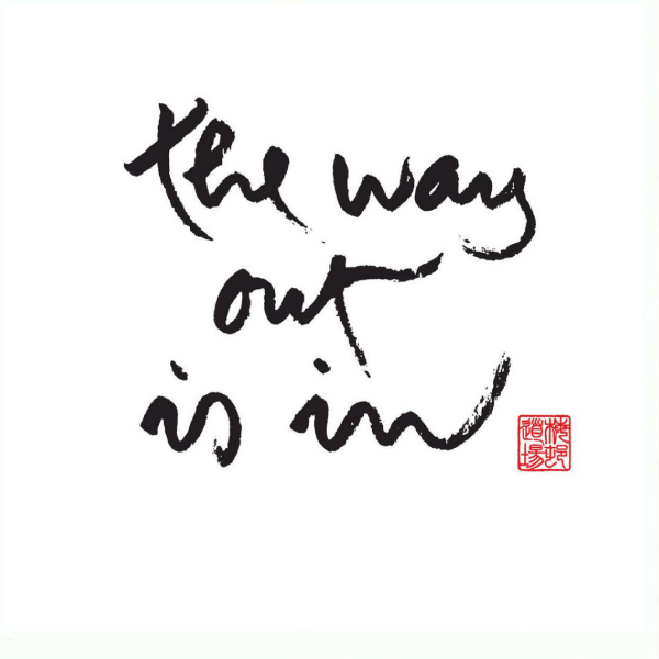 Black on white Thich Nhat Hanh calligraphy - "the way out is in"